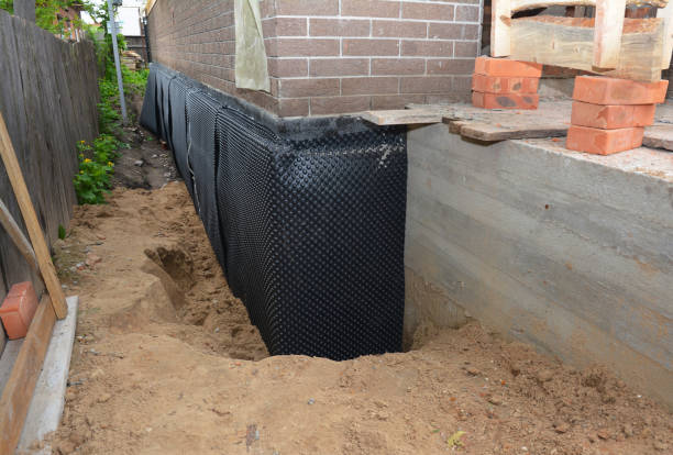 Happy homeowners after waterproofing job in Haworth